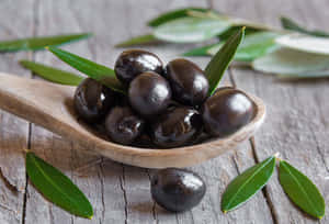 Bowl Of Fresh Black Olives Wallpaper