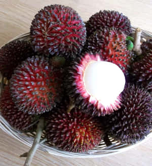Bowl Of Ripe Pulasan Fruits Wallpaper