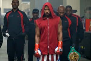 Boxer Adonis Creed Walks With Team.jpg Wallpaper