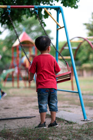 Boy In Playground Wallpaper