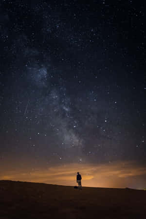 Boy Under Galaxy Sky Wallpaper