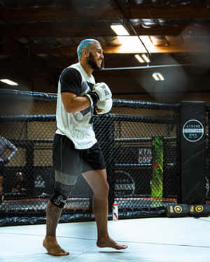 Brad Tavares In The Ring With Boxing Gloves Wallpaper