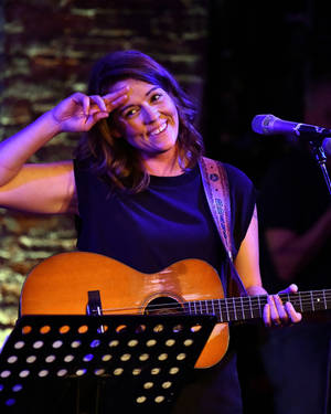 Brandi Carlile Saluting Onstage Wallpaper