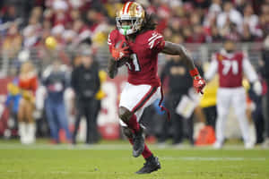 Brandon Aiyuk Running During Game Wallpaper