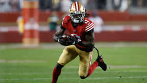 Brandon Aiyuk Running With Football Wallpaper