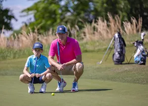 Brandt Snedeker And Son Playing Golf Wallpaper
