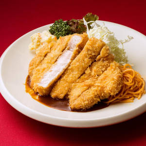 Breaded Tonkatsu With Pasta On A White Plate Wallpaper