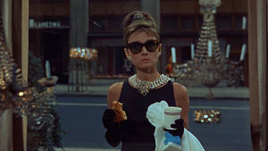 Breakfast At Tiffany's Holding Food Wallpaper