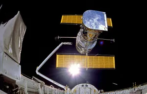 Breathtaking Image Of The Hubble Space Telescope Exploring The Cosmos Wallpaper