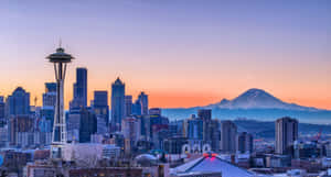 Breathtaking Skyline Of Seattle At Night Wallpaper