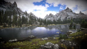 Breathtaking Skyrim Landscape With The Majestic Mountain Backdrop Wallpaper