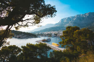 Breathtaking View Of Croatian Mountains Against The Blue Sea Wallpaper