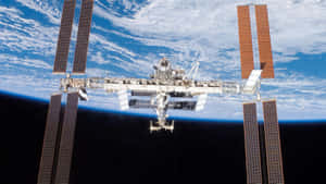 Breathtaking View Of The International Space Station (iss) In Orbit Wallpaper