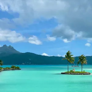 Breathtaking View Of The White Sands And Crystal Clear Waters Of Bora Bora Beach Wallpaper