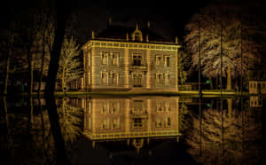 Breda Nighttime Reflectionof Historic Building Wallpaper