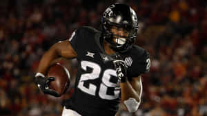 Breece Hall Running Back Action Wallpaper