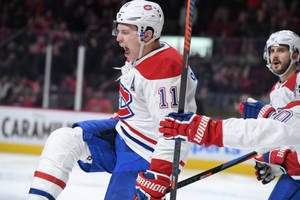 Brendan Gallagher Shouting With Teammates Wallpaper