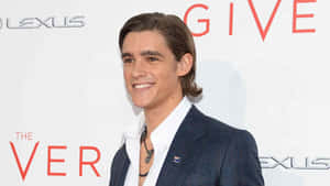 Brenton Thwaites Red Carpet Smile Wallpaper