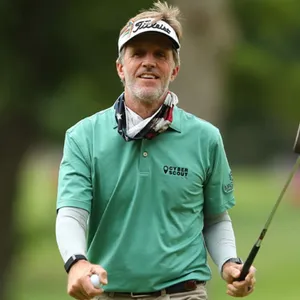 Brett Quigley Club And Ball In Hand Wallpaper