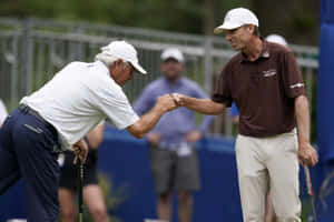 Brett Quigley Fist Bumps Another Golfer Wallpaper