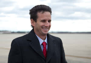 Brian Schatz Smiling On Beach Wallpaper