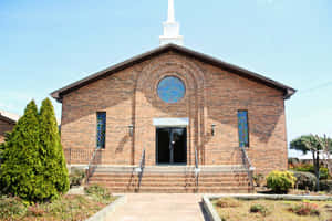 Brick Catholic Church Facade Wallpaper