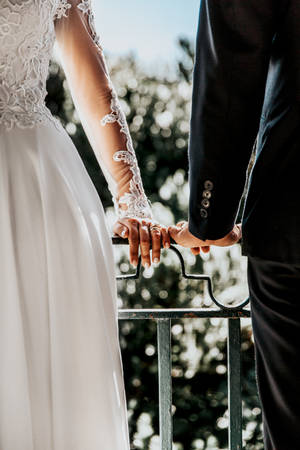 Bride And Groom On Veranda Wallpaper