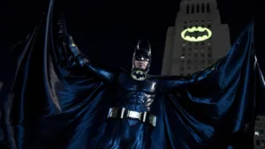 Bright Bat Signal Illuminating The Night Sky Wallpaper