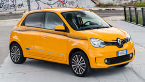 Bright Yellow Renault Twingo Urban Backdrop Wallpaper