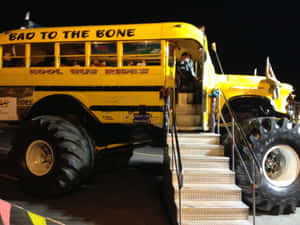 Bright Yellow School Bus Parked Outdoors Wallpaper