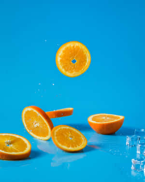 Brighten Up Any Room With The New Orange Iphone. Wallpaper