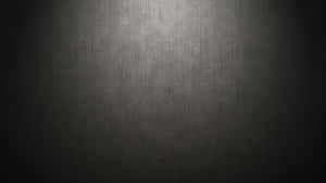 Brighten Your Life With A Glossy And Shimmery Black Metallic Background Wallpaper