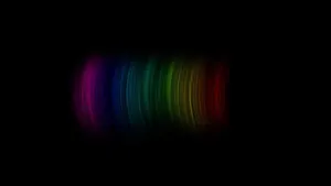 Brightly Colored Rainbow Cutting Through A Pitch Black Sky. Wallpaper