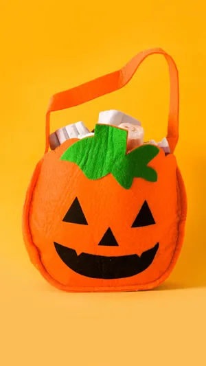 Brightly Colored Trick Or Treat Bags To Celebrate Halloween Wallpaper