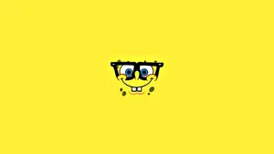 Bring Some Fun To Your Day With This Cheerful Spongebob Face Wallpaper! Wallpaper