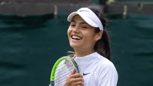 British Tennis Prodigy - Emma Raducanu’s Delightful Smile Wallpaper