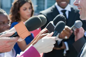 Broadcast The News: A Journalist Enables The Public To Stay Informed Wallpaper