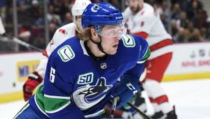 Brock Boeser Vancouver Canucks Chasing Puck Wallpaper