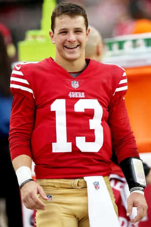 Brock Purdy Smilingin49ers Uniform Wallpaper