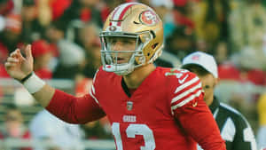 Brock Purdy49ers Quarterback Action Shot Wallpaper