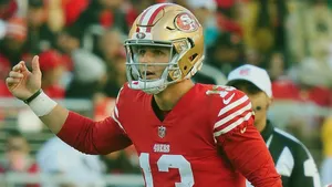 Brock Purdy49ers Quarterback Action Shot Wallpaper