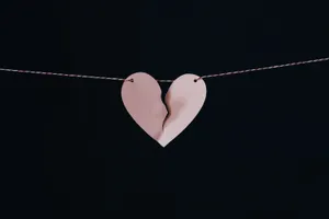 Broken Heart Suspendedon String Wallpaper
