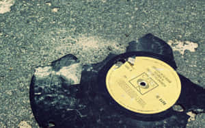 Broken Vinyl Recordon Pavement Wallpaper