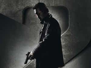Brooding_ Figure_with_ Gun Wallpaper
