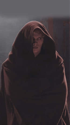 Brooding Figurein Brown Cloak Wallpaper