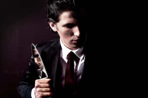 Brooding Manwith Knife Wallpaper