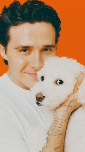 Brooklyn Beckham With Dog Wallpaper