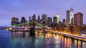 Brooklyn Bridge And City Skyline At Dusk Wallpaper