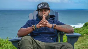 Brooklyn Hat Man Seaside Contemplation Wallpaper