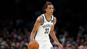 Brooklyn Nets Player Nic Claxton Dribbling Wallpaper